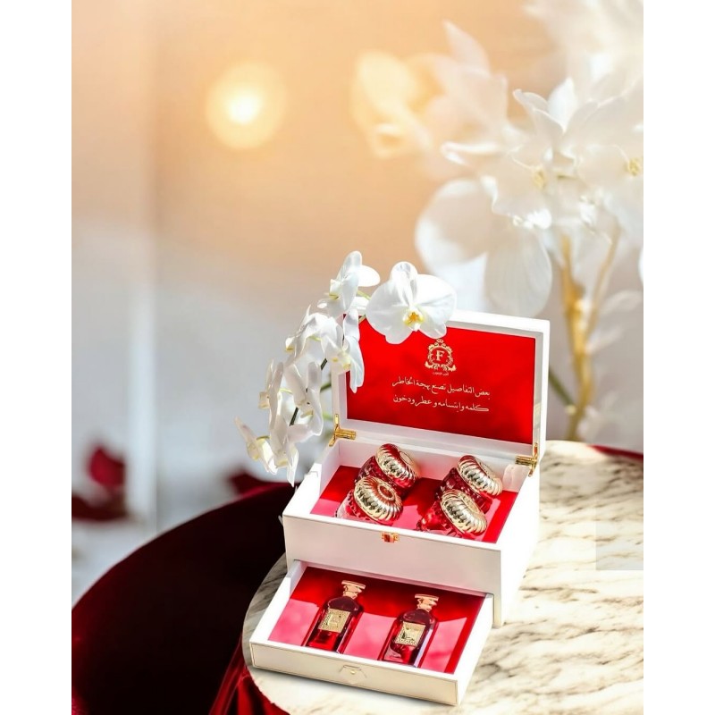 A box of two perfumes, two dukhoon and two Oud